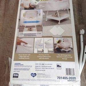 Simmons Kids Gliding Bedside Bassinet - Portable Crib with Activity Mobile